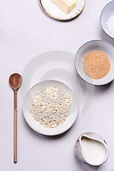 Ingredients for oat porridge: rolled oats or flakes, sugar, salt, milk and butter