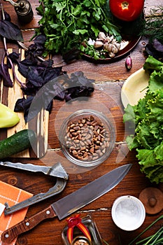 Ingredients for pesto sauce with pine nuts  laying at wooden table