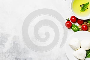 Ingredients for prepared spring salad with tomatoes, mozzarella