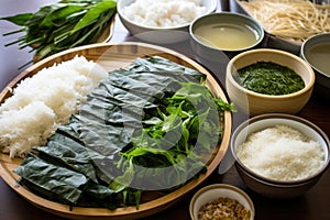 ingredients for preparing sushi including rice, seagrasses, and fish