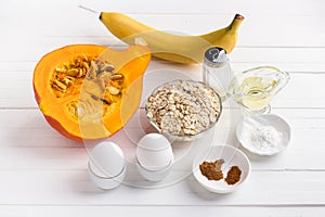 Ingredients for pumpkin pancakes with oatmeal and banana: pumpkin, banana, oatmeal, eggs, vegetable oil, spices, salt, baking