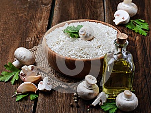 Ingredients for risotto: rice, mushroom, garlic, oil