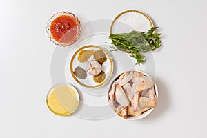 Ingredients for roasting chicken wings. Culinary background with selective focus
