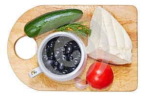 Ingredients for salad on a board. On a white background