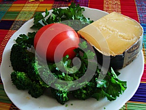 Ingredients for salad: Broccoli, cheese, tomato, parsley