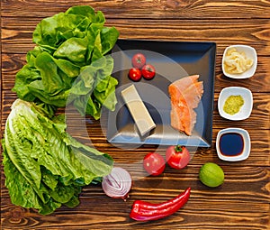 Ingredients for salad with salmon and vegetables