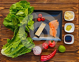 Ingredients for salad with salmon and vegetables