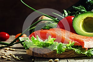 Ingredients for salad with smoked salmon and avocado, foods are