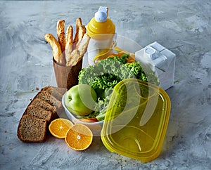 Ingredients for school lunch and plastic container on the table, close-up, selective focus