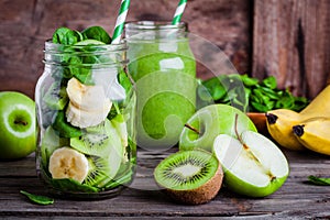 Ingredients for smoothie in jar: banana, kiwi, spinach, green apple