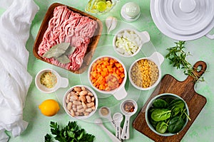 Ingredients for soup with meatballs and vegetables.