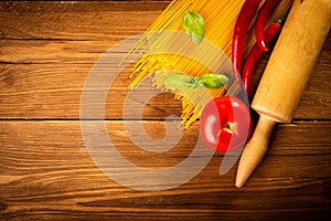 Ingredients for spaghetti on a wooden table