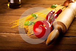 Ingredients for spaghetti on a wooden table