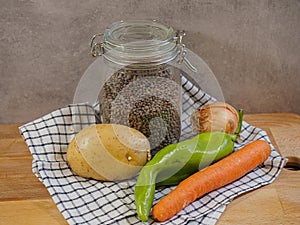 ingredients to make a natural lentil stew: lentils, onion, carrot, green pepper