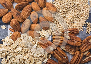 Ingredients to prepare smoothie of banana and seeds, walnut, oatmeal, almond, sesame, a healthy breakfast 2