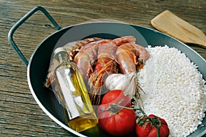 Ingredients to prepare a spanish paella or arroz negro photo