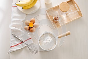 Ingredients and tools to make a cake, flour, butter, sugar,eggs