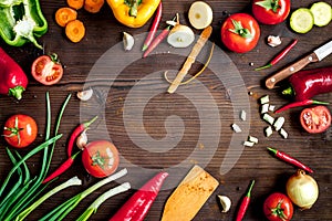 Ingredients for vegetable ragout on wooden background top view