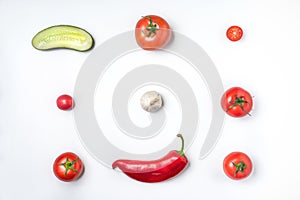 Ingredients for vegetable soup gazpacho on a white background