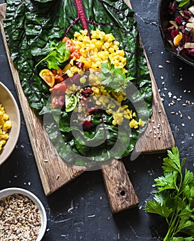 Ingredients for vegetarian chard packets. Chard leaves stuffed with turmeric lentils and vegetables. Vegetarian healthy food