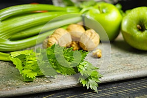 Ingredients for Waldorf salad - celery, apples, walnotes - fres