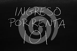 Ingreso Por Renta 101 On A Blackboard.  Translation: Rental Income 101 photo