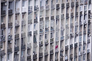 Inhabited, old and neglected communist block of flats