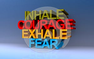 inhale courage exhale fear on blue photo