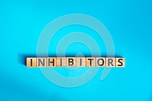 inhibitors inscription wooden cubes with letters photo