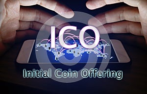 Initial coin offering and hand man protection smartphone with ICO concept. photo