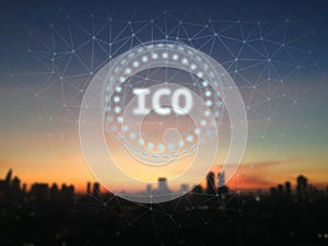 Initial Coin Offering ICO glow led sign over sunrise and city background.