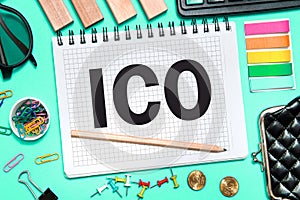 initial coin offering. ICO with office tools on blue background. Concept of the choice ICO