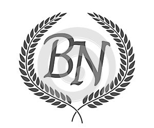 Initial letter B and N, BN monogram logo design with laurel wreath. Luxury calligraphy font photo
