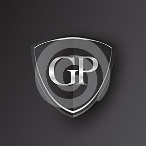 Initial logo letter GP with shield Icon silver color isolated on black background, logotype design for company identity