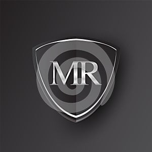 Initial logo letter MR with shield Icon silver color isolated on black background, logotype design for company identity