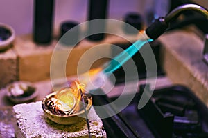 Initial stage of melting precious metals in a jewelry workshop