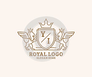 Initial YI Letter Lion Royal Luxury Heraldic,Crest Logo template in vector art for Restaurant, Royalty, Boutique, Cafe, Hotel,