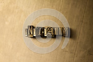 INITIALLY - close-up of grungy vintage typeset word on metal backdrop photo