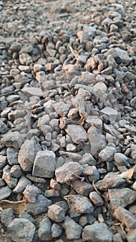 Initially, it was a lump of rock, then it was broken down to become gravel photo