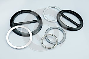 Injection molded plastic fittings for the belt of dresses or skirts.