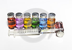Injection needle syringe and vials with medicine on white