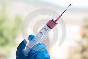 Injection syringe with blood