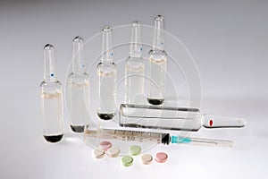 Injection and syringe and tablets