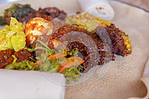 Injera with an assortment of toppings