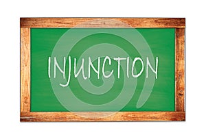 INJUNCTION text written on green school board photo