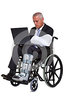 Injured businessman in a wheelchair isolated