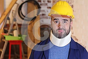 Injured construction worker with cervical collar