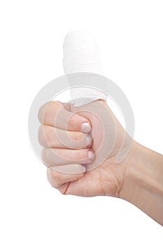 Injured finger with bandage on white background