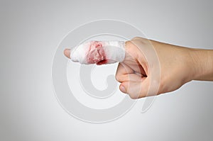 Injured finger with bloody bandage