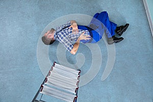 Injured Handyman Lying On Floor